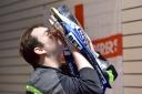 KISS: Chris Rawlinson holds the League One trophy