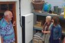 COME ON IN: Fourteen homes across West Dorset are set to open for the sixth Open EcoHomes, image of John Tassel with a Tesla Powerwall and wood pellets