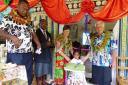 Margaret and Peter Long are handed the scissors to cut the ribbon and open their latest kindergarten at Rukuruku