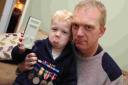 LOST MEDAL: Ollie, 3, and dad Adam Collinge