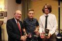 BIG WINNER: Sean Dimmick, centre, with club captain Colin Huckle, left, and Luke Maddison