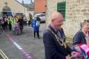 Bridport Mayor Dave Bolwell unravels town's longest scarf from Bridport Community Kitchen