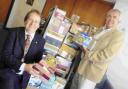 Rotary Club of Weymouth president Kevin Vincent, left,  and international officer Alan Burt with the Treats for Troops boxes donated by their members
