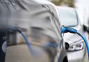 An electric car charging Picture: John Walton/PA Wire