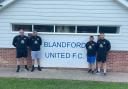 Josh Feirn, second right, will step away from the Blandford United job Picture: BLANDFORD UNITED FC