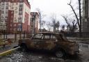 A damaged by shelling car is seen in a yard in Irpin, in the outskirts of Kyiv, Ukraine, Monday, April 11, 2022. (AP Photo/Evgeniy Maloletka).
