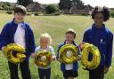 Youngsters at St Andrew's C of E Primary School in Weymouth celebrate the 'good' rating from SIAMS