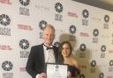 David Miller collected his award at a ceremony in London with his partner Anna