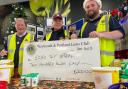 Club president Ryan Hope with Lions Kevin Brookes and Trevor Stratton are seen pictured at the Weymouth ASDA Supermarket with the cheque.