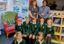 Amy Howe (headteacher) and Robert Stoner (deputy headteacher). with pupils from Corfe Castle  Primary School