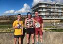 Weymouth Bay 10k winner Shaun Dixon, centre, with George Mallinson, right, and Cory Stone