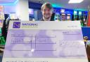 Weymouth Leo Leisure manager Ben with the cheque for £50,000 that was presented to the winner