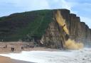 This video shows the dramatic moment tonnes of rock fell from the cliff at West Bay