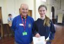 Sophia Fielding will now compete at the national finals for her piece of art  (pictured with Dave Harris Rotary club president)