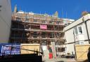 Scaffolding has been erected around The Rectory building in Weymouth town centre as work to restore gets underway