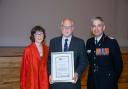 Cllr Pete Barrow (centre) receiving his 'Making a Difference' award from Chief Fire Officer Ben Ansell