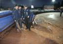 SOAKED: Chris Holder, Ludvig Lindgren and Neil Middleditch on track this evening
