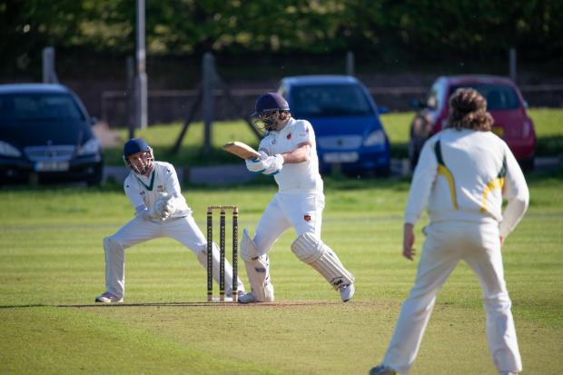 Jon Legg, centre, scored 55 not out and then took 3-24 for Dorchester 		       Picture: DAVID LOVELL