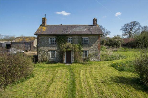 Dorset Echo: This farmhouse, outbuildings and nearly three acres of land is up for auction in October. Picture: Symonds and Sampson