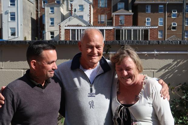 Dorset Echo: Andy Lane (centre) reunited with Ricky Cleverley (left) and Dawn Axe (right). Dawn and Ricky relived Andy two times outside the Waterloo pub in Weymouth. Picture: Dorset Echo