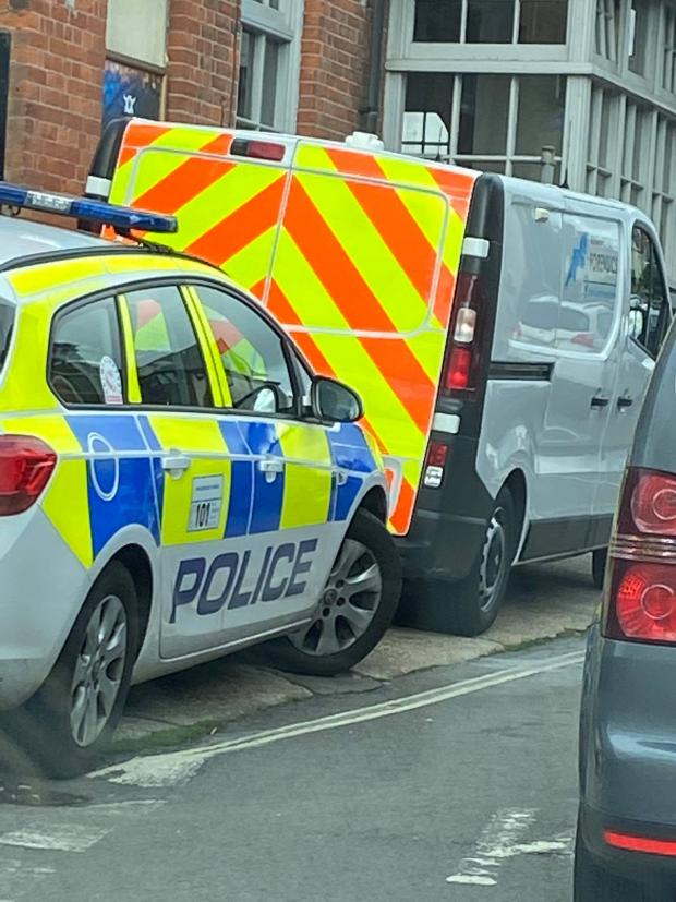 Dorset Echo: Police forensics outside the restaurant the next morning. The Echo arrived as the neighbour was taken away by police Picture: Joff Staple