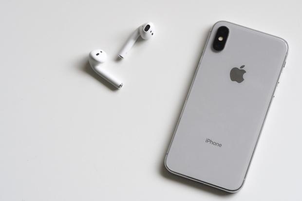 Dorset Echo: iPhone and Airpods. Credit: Canva