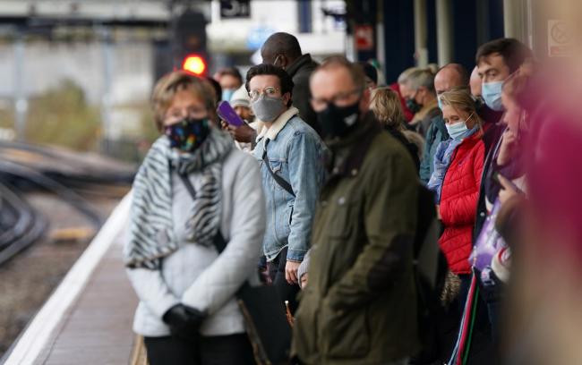 Passengers wait for trains at Ashford Railway Station in Kent, as mask wearing on public transport becomes mandatory to contain the spread of the Omicron Covid-19 variant. Picture: Tuesday November 30, 2021.