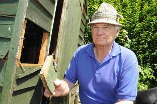 Dorchester allotment co-ordinator Ken Lambert with the damage to one of the sheds