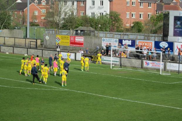 Dorchester celebrate with their supporters at Salisbury after achieving safety Picture: NEIL WALTON