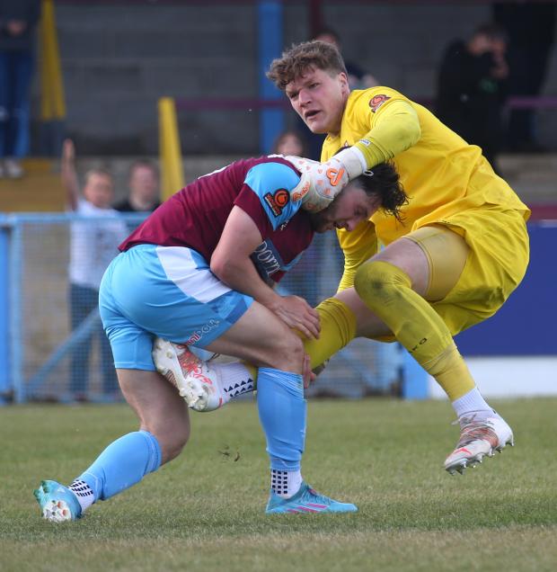 Dorset Echo: Tom Bearwish and Aymen Azaze had a scuffle of their own on the near touchline Picture: MARK PROBIN