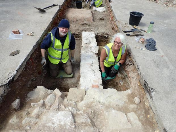 Dorset Echo: Volunteers Jason James and Sally Holland hard at work on the dig