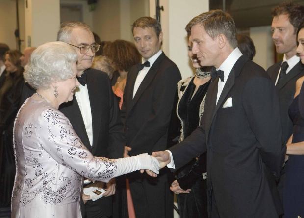 Dorset Echo: The Queen and Daniel Craig. PA