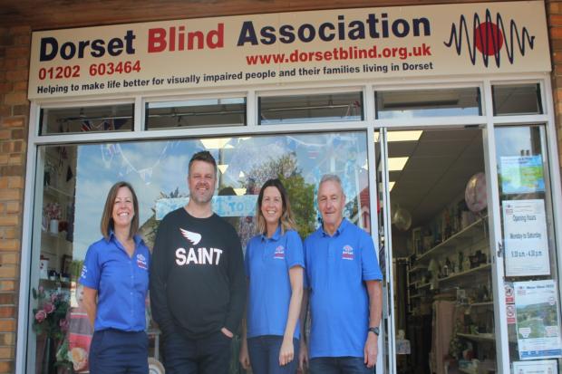 Graeme with, his dad, Dave, shop manager Gemma and, community relations officer, Sam. Picture: Dorset Blind Association.