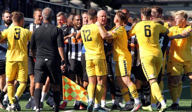 Dorset Echo: A big melee marred the end of the game Picture: IDRIS MARTIN