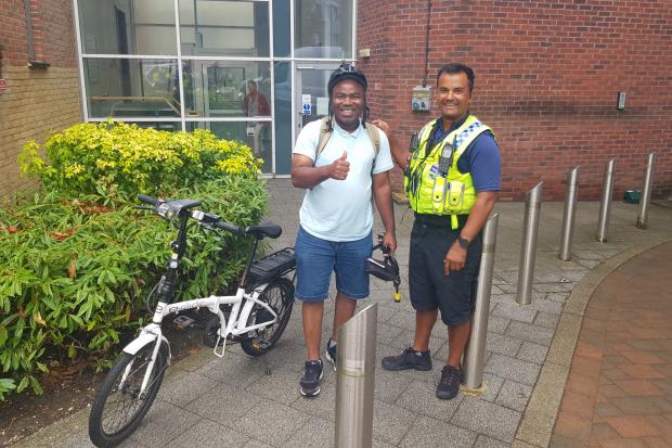 PCSO Harold (right) with member of the public reunited with his stolen bike. Picture: Bournemouth Police
