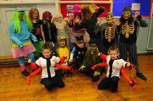 Symondsbury School pupils dress up as monsters.