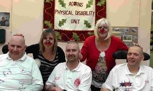 Catherine Bartless and Debbie Pizzie with from left, Reg Jolliffe, Ray Allington and Adrian Thomas at the head shaving fundraising at The Acorns Day Centre.