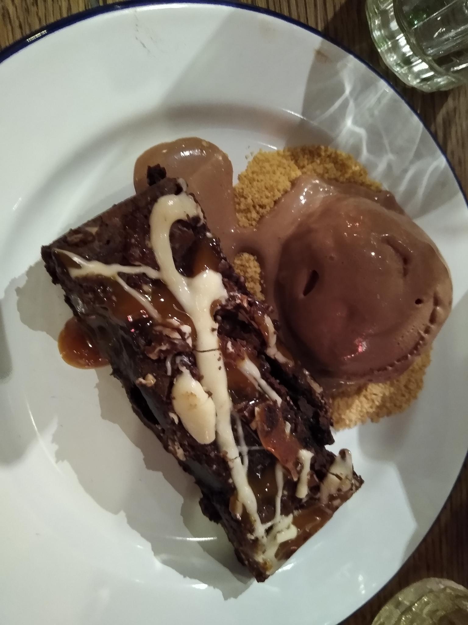 Chocolate fudge peanut brownie with chocolate ice-cream and a biscuit base