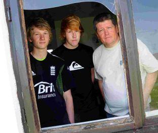 Matthew Randell, Jordan Wilson and Andrew Randell looking through the smashed window at Portland Red Trangle cricket club