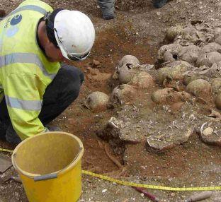 Archaeologists at work on the Viking burial pit