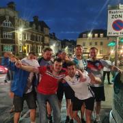England fans celebrate on Weymouth Town Bridge after the team's 4-0 win over Ukraine Picture: Bradley White