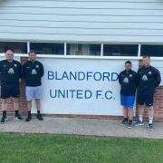 Josh Feirn, second right, will step away from the Blandford United job Picture: BLANDFORD UNITED FC