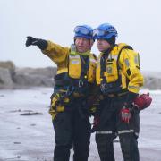 A coastguard search and rescue team in New Brighton, Merseyside, as Storm Eunice hits the south coast. Photo via PA.