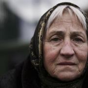 Svetlana, 76 years old, who fled from Odessa, Ukraine, sits at the border crossing in Kroscienko, Poland, Tuesday, March 8, 2022 Picture: (AP Photo/Markus Schreiber).