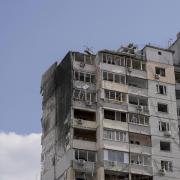 An apartment building is damaged after parts of a Russian missile, shot down by Ukrainian air defense, landed in a residential area, according to authorities, in Kyiv, Ukraine, Thursday, March 17, 2022 (AP Photo/Vadim Ghirda)