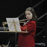 A Sunninghill Prep School pupil playing the flute at a previous year's Weymouth Music Festival