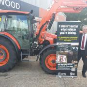 Dorset Police and Crime Commissioner, David Sidwick, pictured with Dorset Police campaign banner