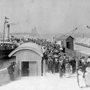 A crowd of people swarm onto Portland in this old picture