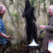 King Charles III laughs with Ian Thackray, a blacksmith who realises his hands are too dirty to shake hands with the King during a Celebration of Craft reception at Highgrove Gardens in Tetbury, hosted by The King's Foundation Picture: Adrian