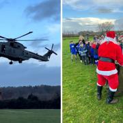 Royal Navy Merlin MK 4 by the 846 Royal Navy squadron  flying over St Mary's CE Middle School and Santa giving out sweets to pupils